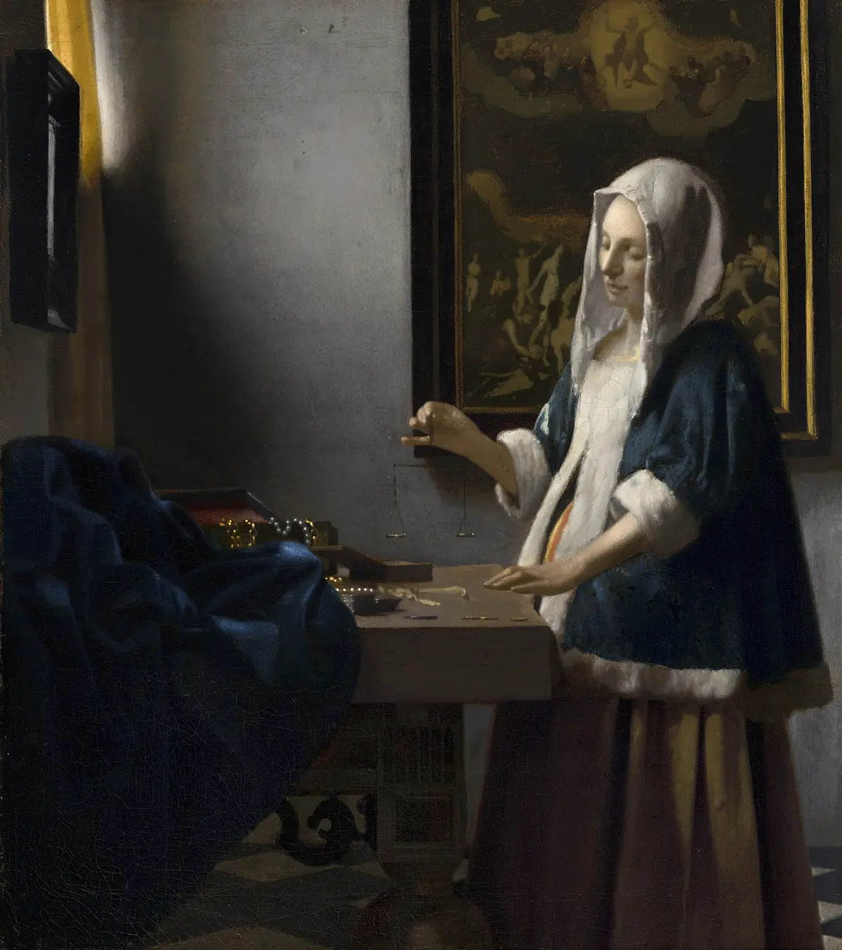 Johannes Vermeer, Donna con bilancia: una donna regge una piccola bilancia vuota davanti a un tavolo con perle e monete.