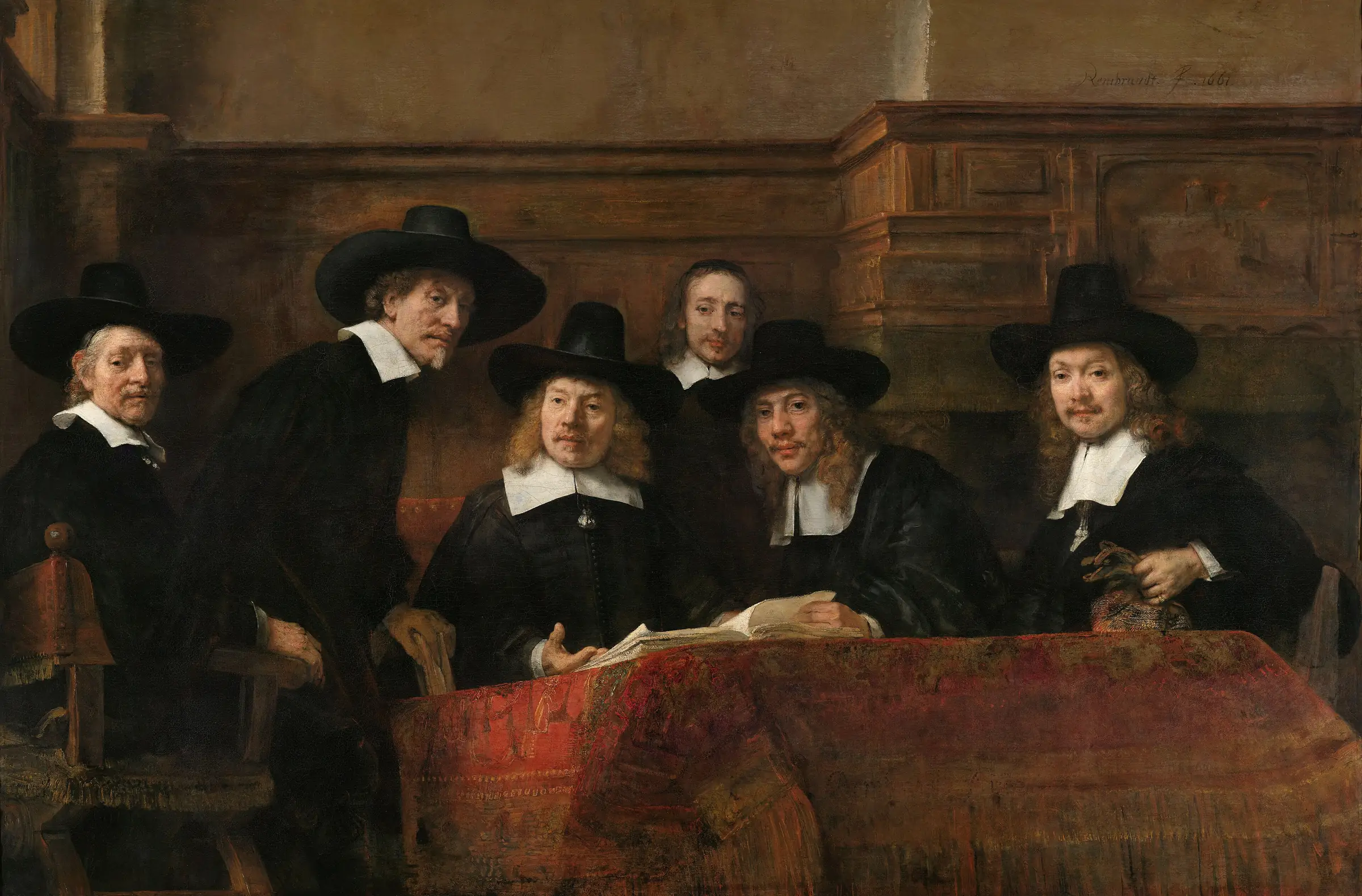 Rembrandt, I sindaci della gilda dei drappieri: sei uomini in abito nero esaminano un registro attorno a un tavolo coperto da un tappeto rosso.